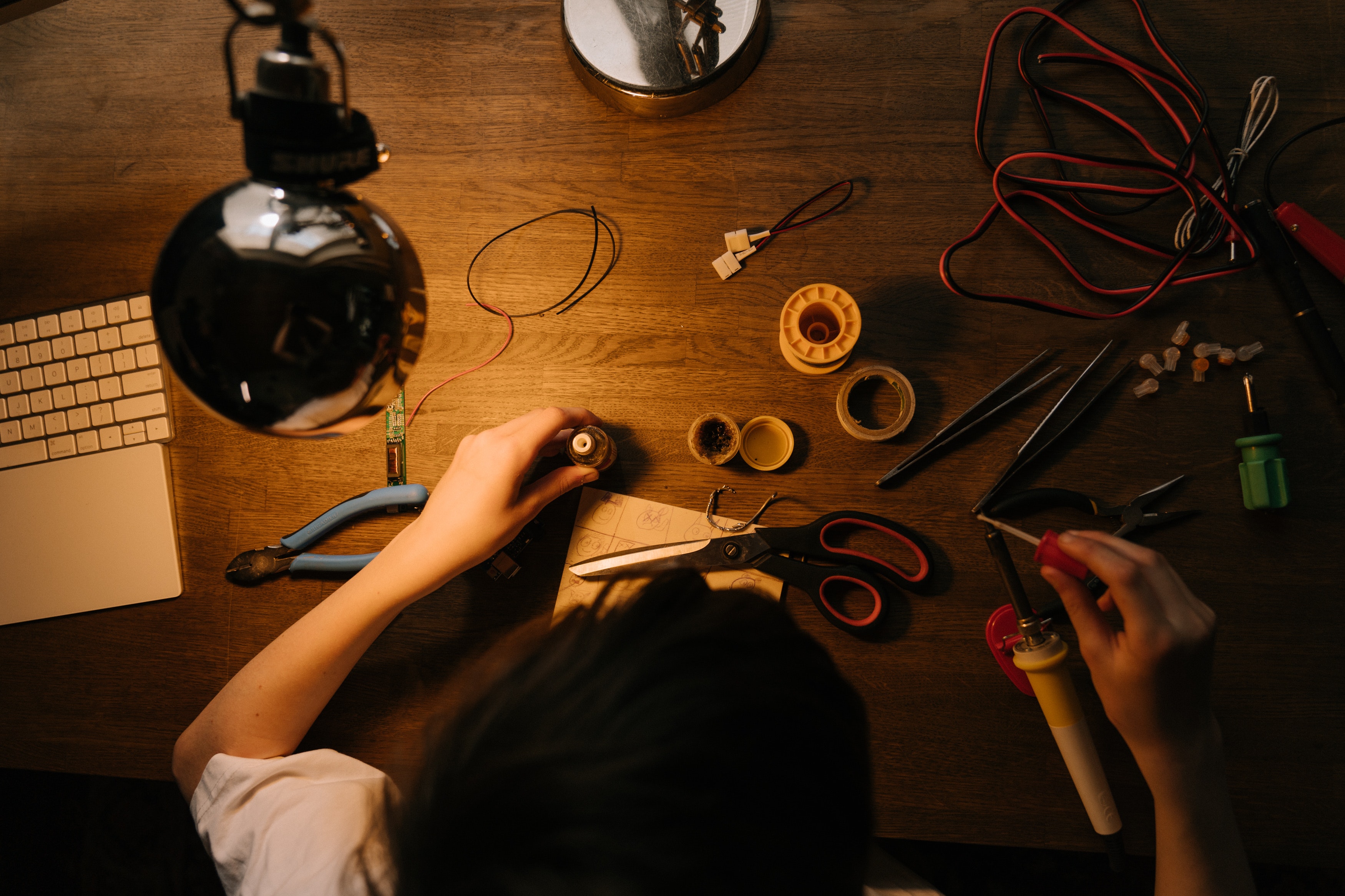 person-holding-pen-and-scissors-4709391 How to split a coaxial cable connection for TV and Internet